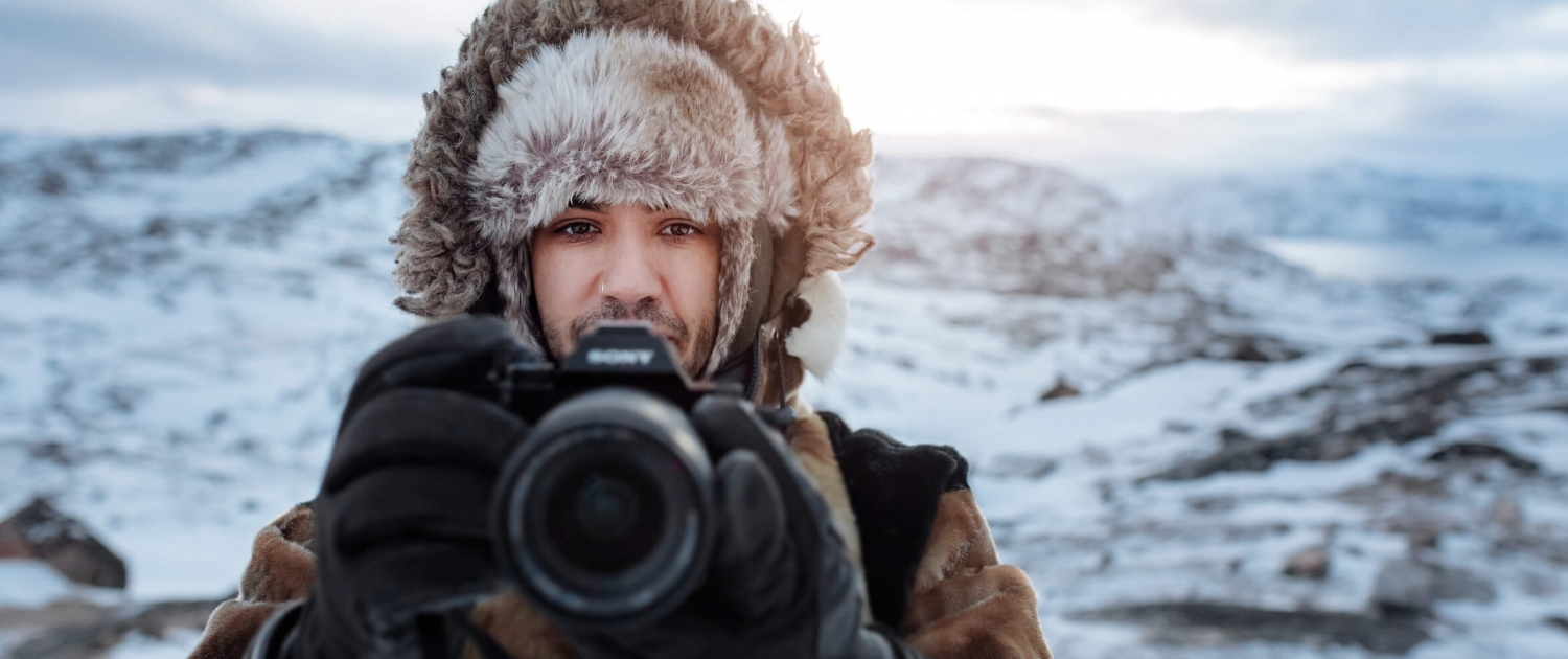 Canadian social media influencer Siya Zarrabi taking photos in seal skin clothes near Ilulissat in Greenland