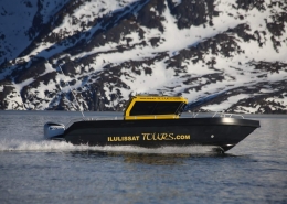 Ilulissattours boat sailing in Winter. Photo by Ilulissat Tours - Visit Greenland