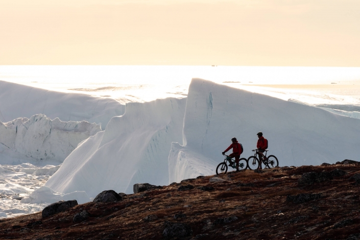 It’s hard to make much progress on the ‘yellow trail’ with breathtaking views like this. Mountain bikers stop to take in the incredible Ilulissat Icefjord. Ilulissat, North Greenland