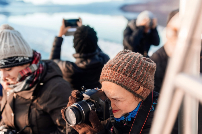 Tourists taking photos, Nuuk Icefjord. Photo by Rebecca Gustafsson - Visit Greenland