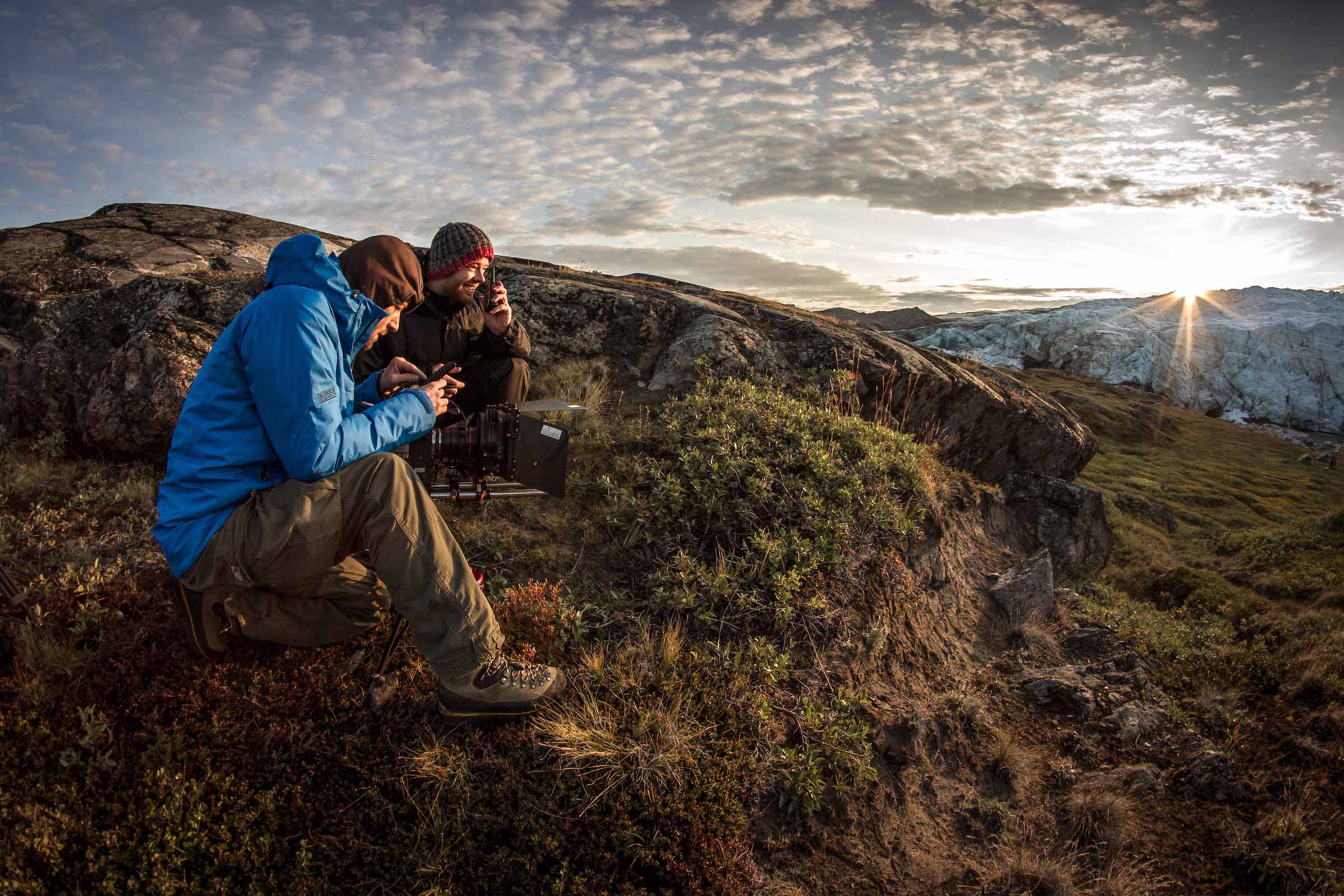 Film makers working at sunrise near Russell Glacier in Greenland. Photo by Mads Pihl - Visit Greenland