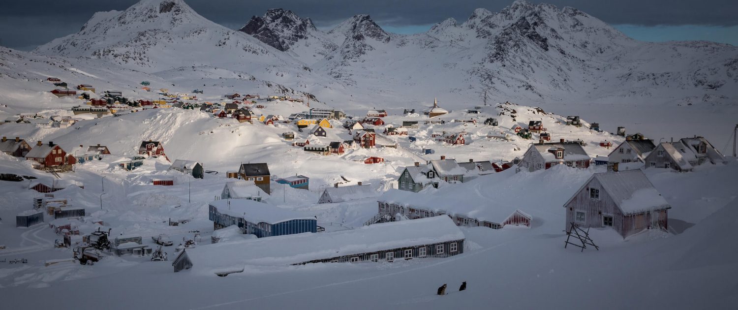 Morning light over Tasiilaq in East Greenland covered in deep snow