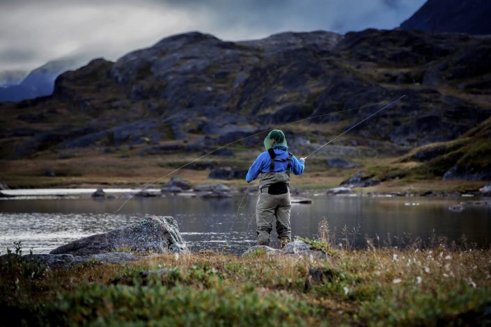 A fly fisherman enjoying the day on the river Erfalik in Greenland. Photo by Mads Pihl, Visit Greenland