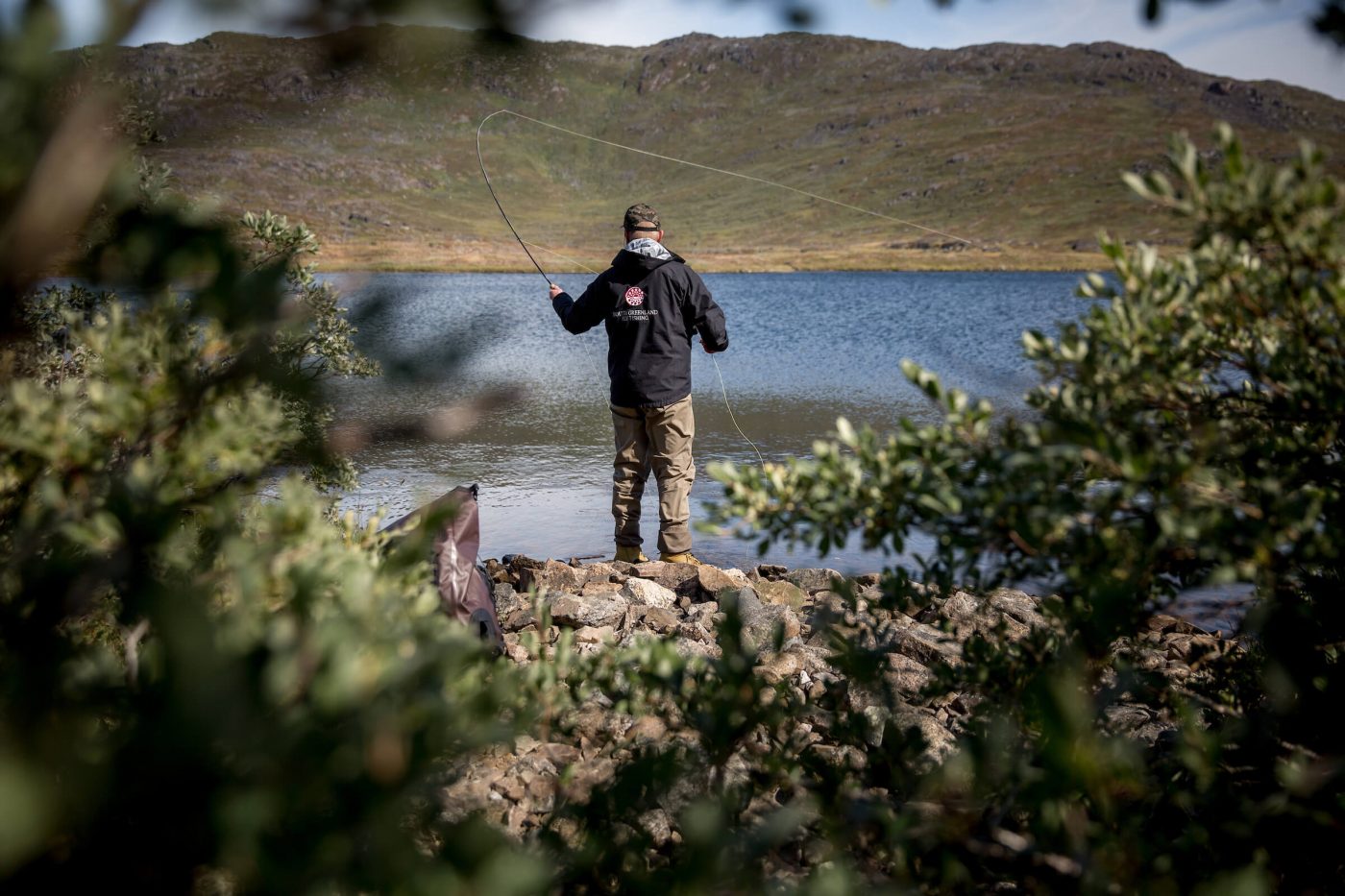 Fly fishing for arctic charr with the guide from South Greenland Fly Fishing. By Mads Pihl