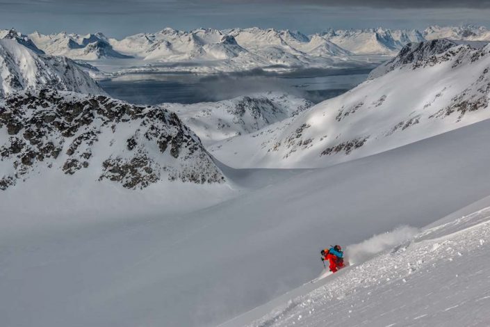 Skier skiing downhill in East Greenland. Photo by Pirhuk - Greenland Expedition Specialists