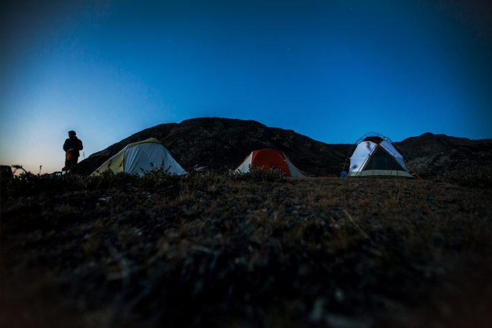 Tourists camping in a tent at Polar Lodge in Kangerlussuaq, Greenland. Photo by Mads Pihl