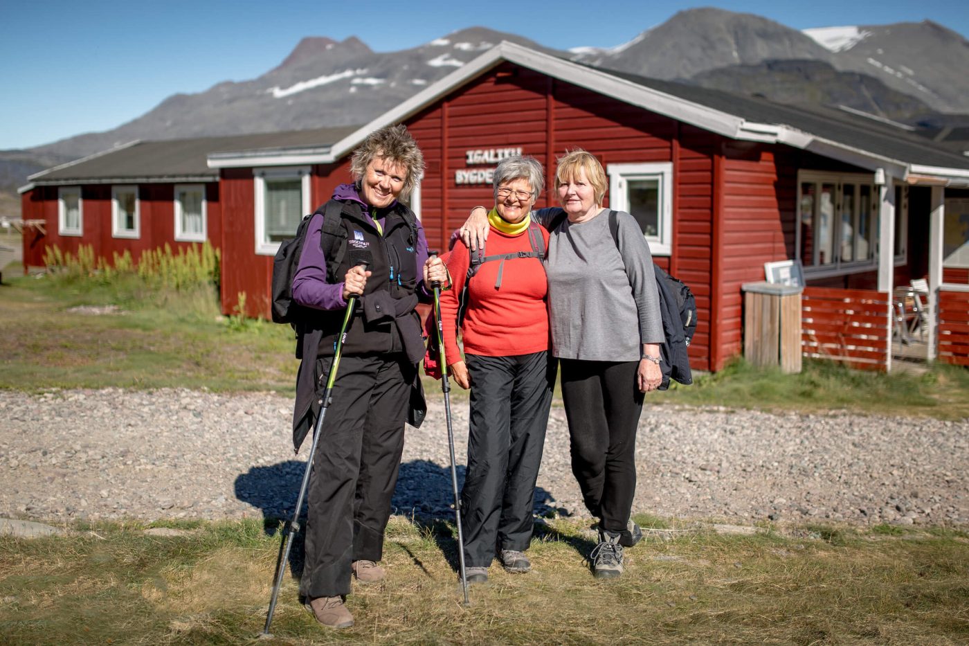 Three female hikers at Igaliku Country Hotel in South Greenland. By Mads Pihl