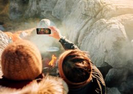 Two women taking a selfie by the fire on the beach in Nuuk in Greenland. Photo by Rebecca Gustafsson