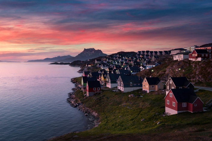 Pink sky, colourful Nuuk. Photo by Elia Locardi - Visit Greenland