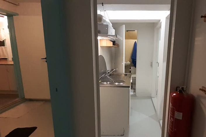 Toilet and laundry room. Photo by Mikami Hostel