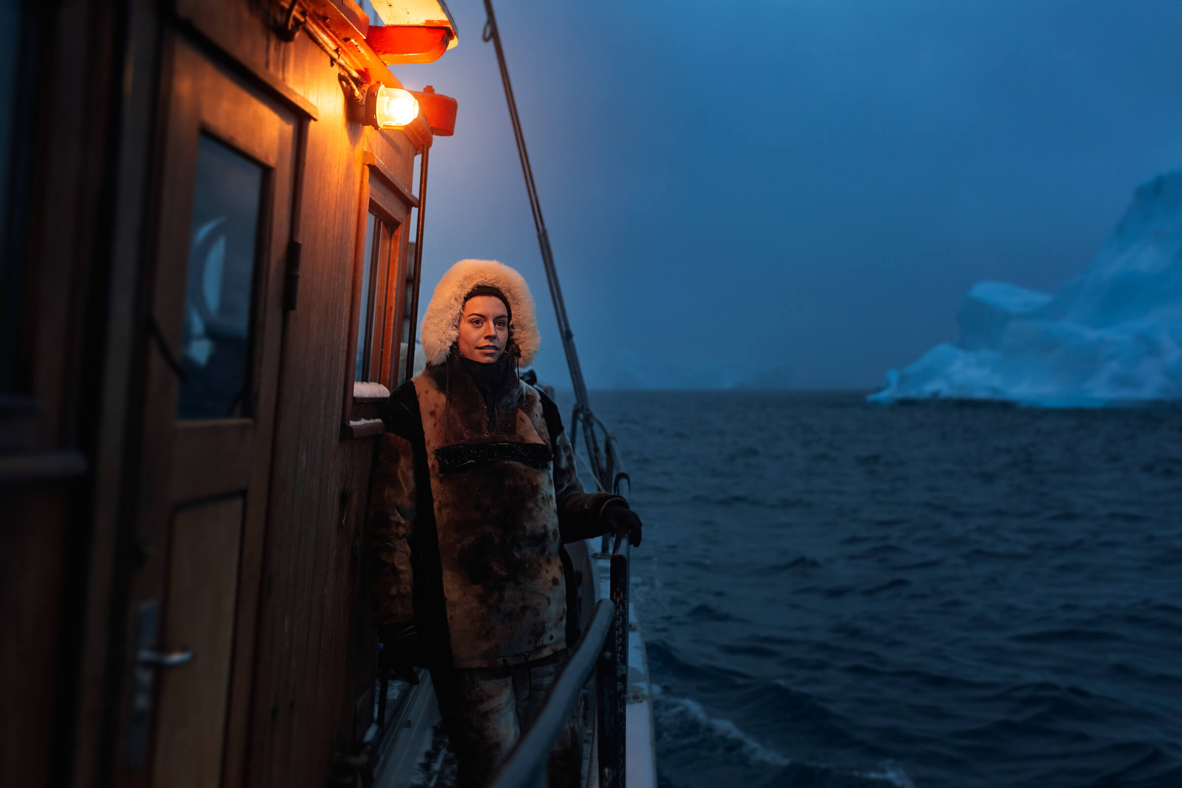 Australian social media influencer Sorelle Amore on a iceberg boat tour during the blue hour in the Ilulissat icegjord in Greenland. By Rebecca Gustafsson