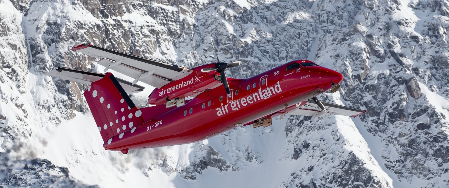 An Air Greenland Dash-8 taking off from Kulusuk in East Greenland. Photo by Mads Pihl - Visit Greenland