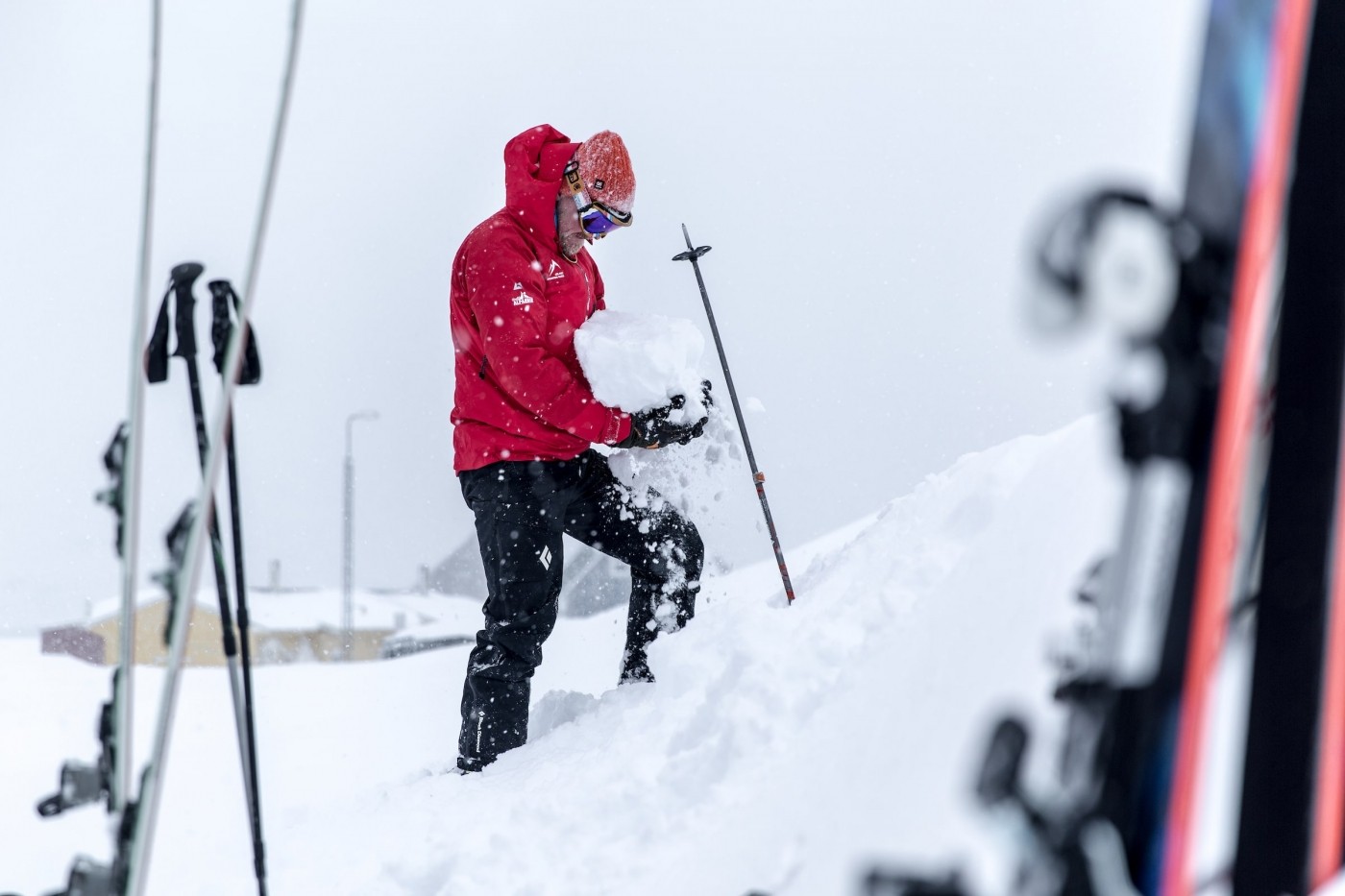 The ski touring guide checking snow conditions in Kuummiut in East Greenland. Photo by Mads Pihl - Visit Greenland