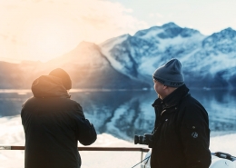 Two men enjoying the sunrise in the Icefjord in Nuuk in Greenland. Photo by Rebecca Gustafsson