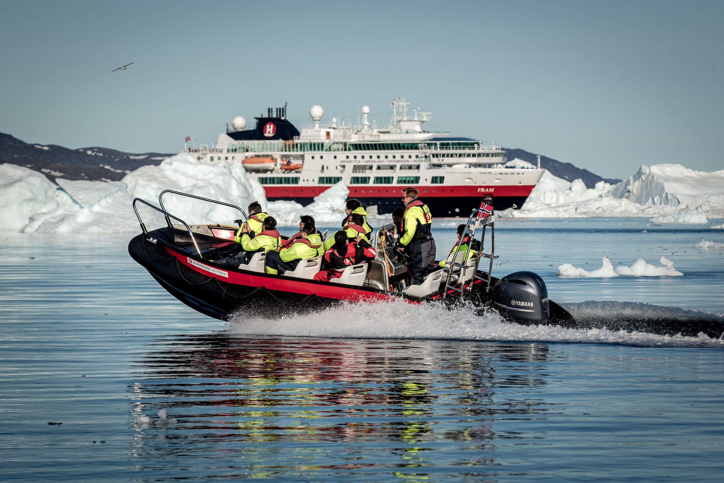 An ice cruise in front of MS Fram in Greenland. By Mads Pihl