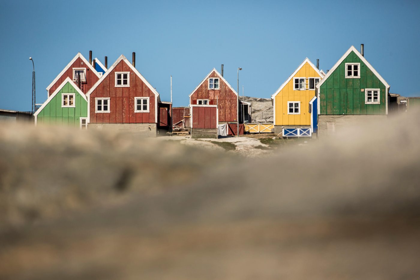 Colourful houses in Qasigiannguit in Greenland. Photo by Mads Pihl - Visit Greenland