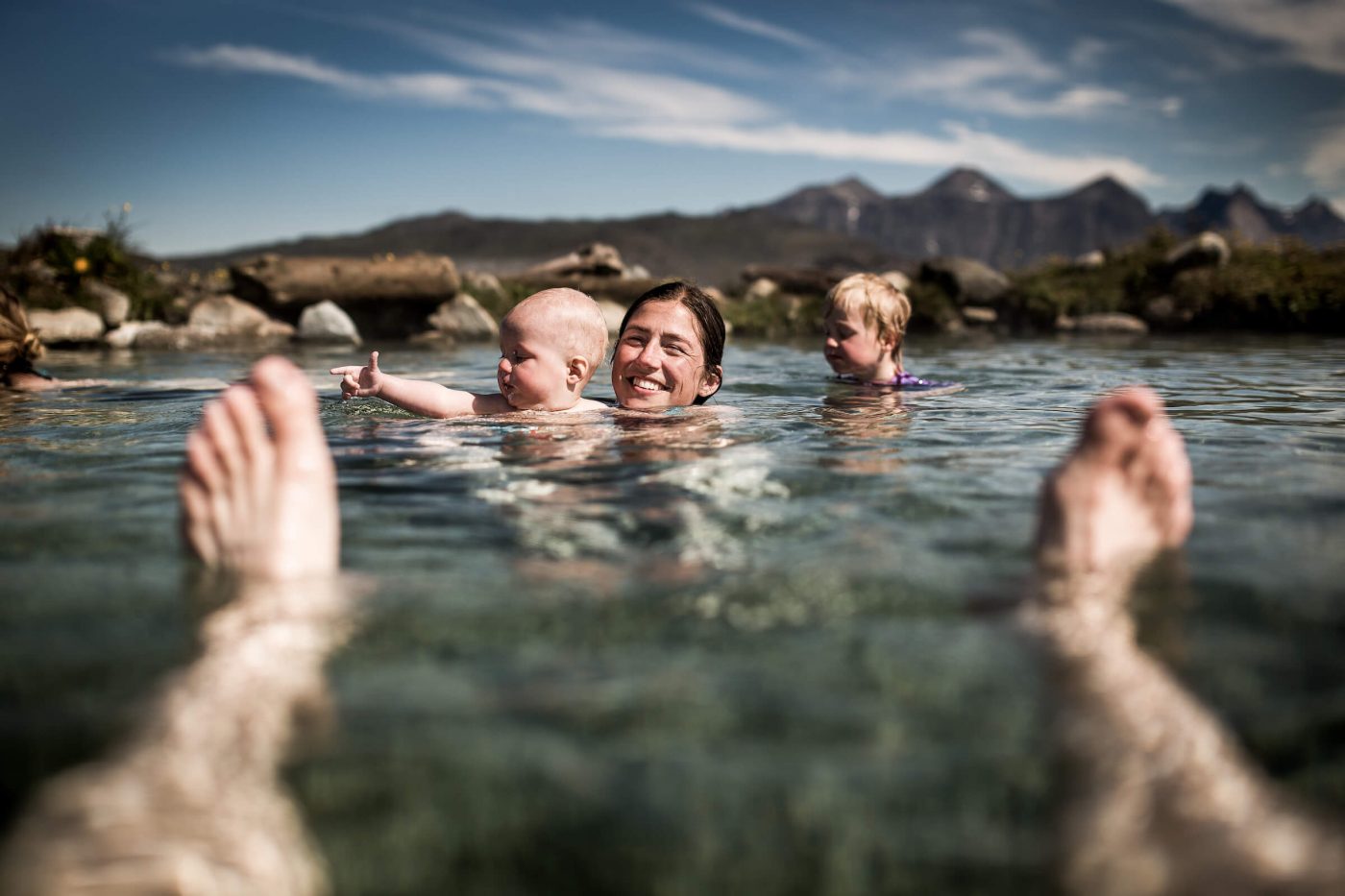 Relaxing at the hot pools of Uunartoq in South Greenland. By Mads Pihl