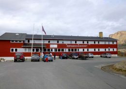 Frontal view of The Sisimiut Seamen’s Home and parking area. Photo by Hotel Sømandshjemmet, Visit Greenland